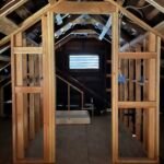 attic conversion ADU with exposed framing of bathroom